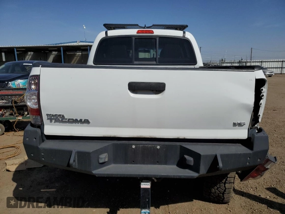 2014 Toyota Tacoma with VIN 3TMLU4EN7EM144839, listed as a Copart auction lot 52728065 with 32,610 mi miles and Salvage Title. Bid and sale history available at DreamBid. Image 6.