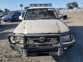 2001 Toyota Land Cruiser with VIN JTEHT05J012006393, listed as a Copart auction lot 50062695 with 319,586 mi miles and Clean Title. Bid and sale history available at carsss.com. Image 5.