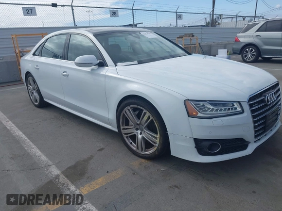 2016 Audi A8 Sport z VIN WAU43AFD3GN011061, wystawiony jako IAAI lot #42034532 z przebiegiem 109 877 mil mil oraz . Historia ofert i sprzedaży dostępna na DreamBid. Obrazek 1.