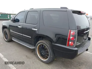 2012 GMC Yukon Denali with VIN 1GKS2EEF5CR129160, listed as a IAAI auction lot 42012417 with 221,871 mi miles. Bid and sale history available at carsss.com. Image 3.