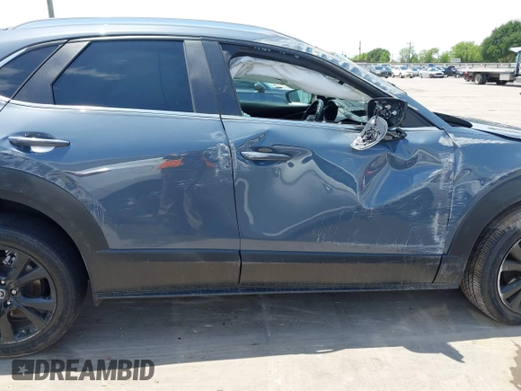2022 Mazda CX-30 S Carbon Edition with VIN 3MVDMBCL6NM410330, listed as a IAAI auction lot 42107426 with 30,277 mi miles and . Bid and sale history available at DreamBid. Image 14.