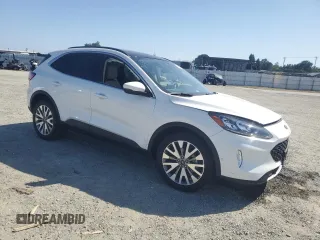 2020 Ford Escape Titanium Hybrid z VIN 1FMCU9DZ6LUC47658, wystawiony jako Copart lot #59599995 z przebiegiem 63 004 mil mil oraz Szkoda całkowita • Salvage title. Historia ofert i sprzedaży dostępna na DreamBid. Obrazek 4.