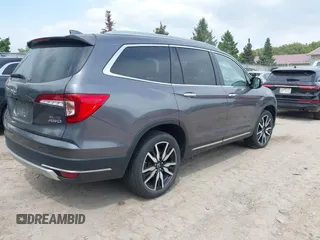 2020 Honda Pilot Elite with VIN 5FNYF6H00LB027472, listed as a IAAI auction lot 42253478 with 69,988 mi miles and . Bid and sale history available at DreamBid. Image 4.