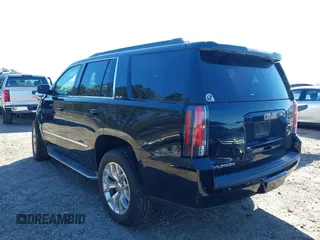 2015 GMC Yukon SLE with VIN 1GKS2AKC4FR720667, listed as a IAAI auction lot 41822277 with 134,984 mi miles and . Bid and sale history available at DreamBid. Image 3.