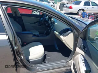 2014 Kia Optima LX with VIN 5XXGM4A71EG335165, listed as a IAAI auction lot 42052378 with 154,574 mi miles. Bid and sale history available at carsss.com. Image 5.