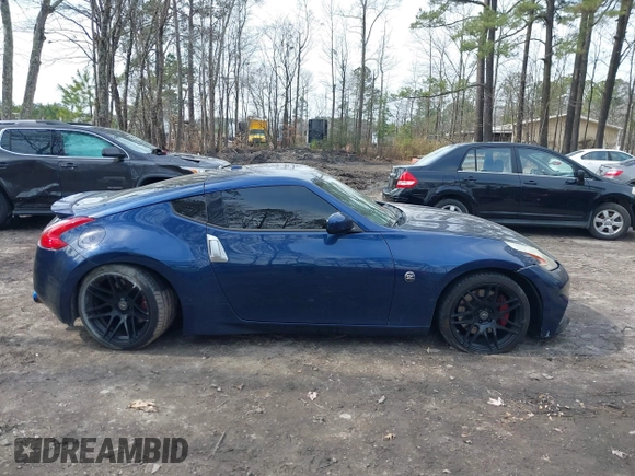 2014 Nissan 370Z Nismo z VIN JN1AZ4EH0EM631950, wystawiony jako IAAI lot #41685567 z przebiegiem 103 282 mil mil oraz . Historia ofert i sprzedaży dostępna na DreamBid. Obrazek 13.
