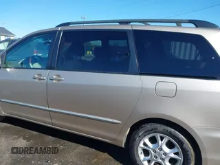 2005 Toyota Sienna XLE with VIN 5TDZA22C95S365448, listed as a IAAI auction lot 41552969 with 214,462 mi miles and . Bid and sale history available at DreamBid. Image 14.