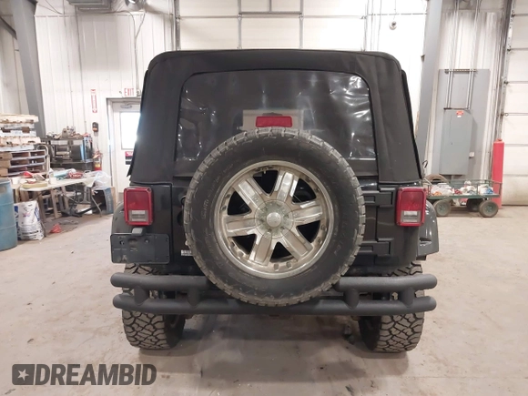 2008 Jeep Wrangler Unlimited X with VIN 1J4GA391X8L558984, listed as a IAAI auction lot 41016498 with 123,308 mi miles. Bid and sale history available at carsss.com. Image 16.