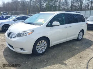 2015 Toyota Sienna XLE with VIN 5TDYK3DC0FS570007, listed as a IAAI auction lot 41794333 with 217,512 mi miles. Bid and sale history available at carsss.com. Image 2.