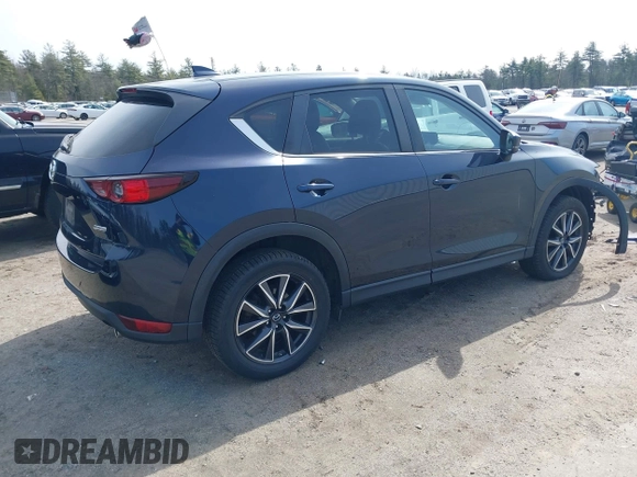 2018 Mazda CX-5 Touring z VIN JM3KFBCM4J0379871, wystawiony jako IAAI lot #41865130 z przebiegiem 48 674 mil mil oraz . Historia ofert i sprzedaży dostępna na DreamBid. Obrazek 4.