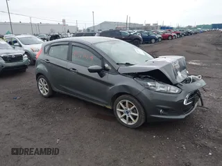 2019 Ford Fiesta SE z VIN 3FADP4EJ3KM137591, wystawiony jako IAAI lot #41974524 z przebiegiem 180 490 mil mil oraz . Historia ofert i sprzedaży dostępna na DreamBid. Obrazek 1.