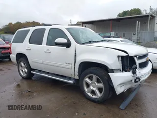 2013 Chevrolet Tahoe LT with VIN 1GNSKBE06DR239827, listed as a IAAI auction lot 40588437 with 136,512 mi miles and . Bid and sale history available at DreamBid. Image 1.