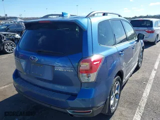 2018 Subaru Forester Touring with VIN JF2SJAWCXJH467976, listed as a IAAI auction lot 41744472 with 98,919 mi miles. Bid and sale history available at carsss.com. Image 4.