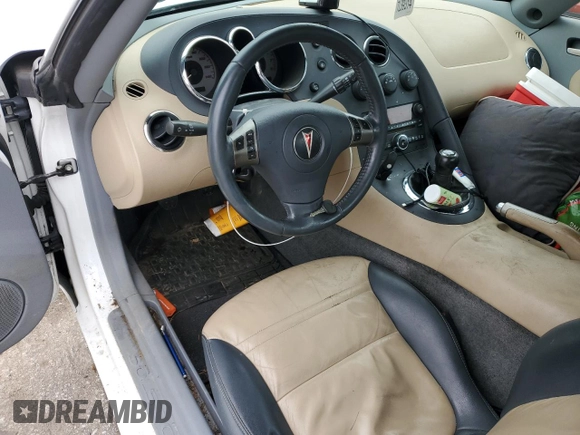 2006 Pontiac Solstice z VIN 1G2MB33B56Y106095, wystawiony jako Copart lot #79906094 z przebiegiem 54 475 mil mil oraz Szkoda całkowita • Salvage title. Historia ofert i sprzedaży dostępna na DreamBid. Obrazek 8.