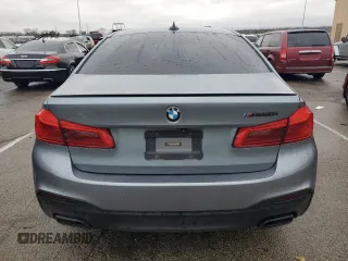2018 BMW 5 Series M550i xDrive with VIN WBAJB9C54JB286707, listed as a Copart auction lot 49158435 with 74,307 mi miles and Salvage title. Bid and sale history available at DreamBid. Image 6.