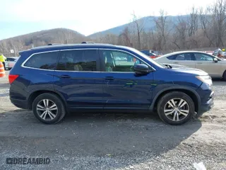 2017 Honda Pilot EX-L with VIN 5FNYF5H52HB031634, listed as a IAAI auction lot 41145133 with 164,668 mi miles. Bid and sale history available at carsss.com. Image 13.