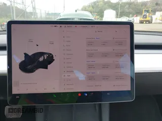 2021 Tesla Model 3 Long Range with VIN 5YJ3E1EB7MF052988, listed as a IAAI auction lot 42052662 with 29,877 mi miles and . Bid and sale history available at carsss.com. Image 18.