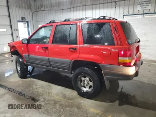 1997 Jeep Grand Cherokee Laredo with VIN 1J4GZ58Y5VC674687, listed as a Copart auction lot 43137095 with 173,228 mi miles and Salvage Title. Bid and sale history available at carsss.com. Image 2.