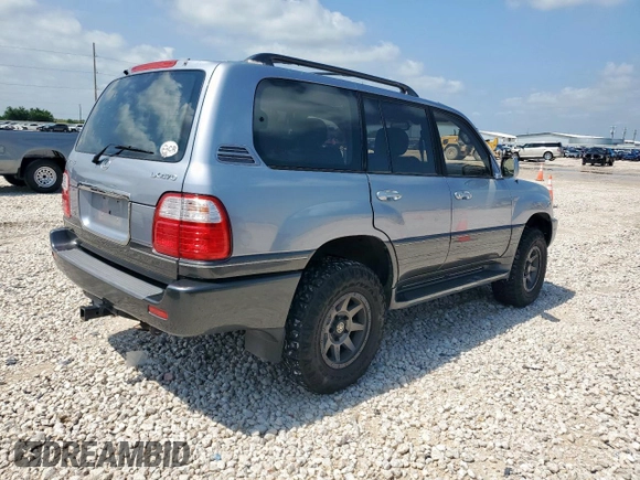 2001 Lexus LX 470 z VIN JTJHT00W313504330, wystawiony jako Copart lot #61126435 z przebiegiem 87 049 mil mil oraz Czysty tytuł • Clean title. Historia ofert i sprzedaży dostępna na DreamBid. Obrazek 3.