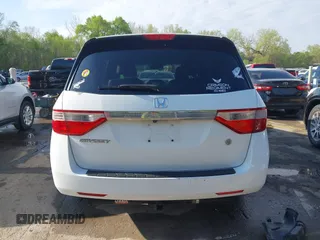 2012 Honda Odyssey EX-L with VIN 5FNRL5H62CB010054, listed as a IAAI auction lot 42040117 with 189,566 mi miles and . Bid and sale history available at carsss.com. Image 17.
