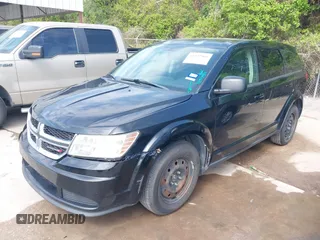 2014 Dodge Journey SE with VIN 3C4PDCABXET235827, listed as a IAAI auction lot 41927966 with 186,179 mi miles and . Bid and sale history available at carsss.com. Image 2.