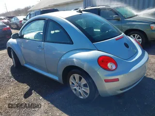2010 Volkswagen New Beetle Coupe with VIN 3VWRW3AG2AM018644, listed as a IAAI auction lot 41815380 with 99,738 mi miles. Bid and sale history available at carsss.com. Image 3.