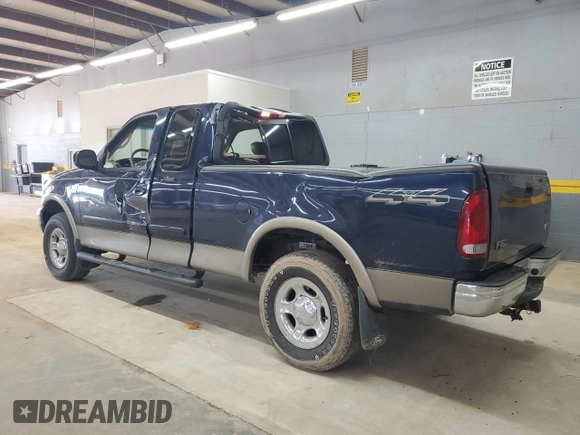 2002 Ford F-150 XL with VIN 1FTRX18L62NA69837, listed as a Copart auction lot 61581935 with 130,078 mi miles and Salvage title. Bid and sale history available at DreamBid. Image 2.