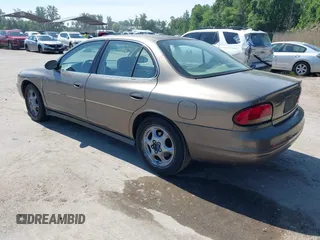 1999 Oldsmobile Intrigue GX z VIN 1G3WH52K5XF334949, wystawiony jako IAAI lot #42252647 z przebiegiem 80 705 mil mil oraz . Historia ofert i sprzedaży dostępna na DreamBid. Obrazek 3.