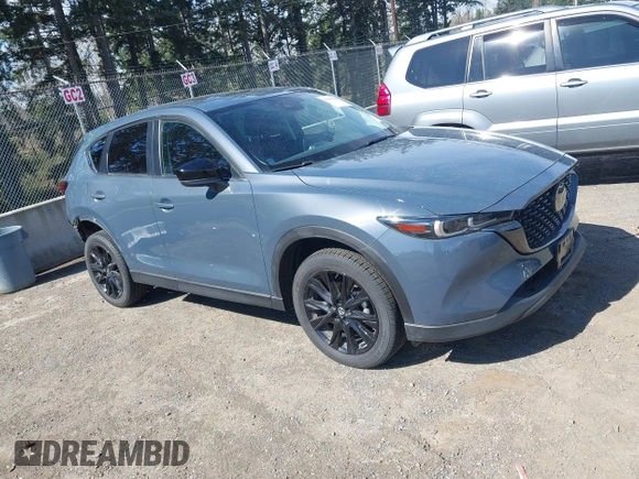 2023 Mazda CX-5 2.5 S Carbon Edition with VIN JM3KFBCM8P0134757, listed as a IAAI auction lot 41893648 with 9,587 mi miles. Bid and sale history available at carsss.com. Image 1.
