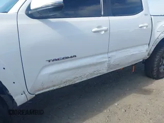 2023 Toyota Tacoma SR with VIN 3TYCZ5AN2PT112854, listed as a IAAI auction lot 42220025 with 43,657 mi miles and . Bid and sale history available at DreamBid. Image 21.