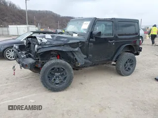 2014 Jeep Wrangler Sahara with VIN 1C4AJWBG9EL311477, listed as a IAAI auction lot 41884255 with 82,221 mi miles and . Bid and sale history available at carsss.com. Image 18.
