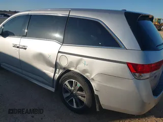 2014 Honda Odyssey Touring with VIN 5FNRL5H97EB094353, listed as a IAAI auction lot 41701712 with 141,228 mi miles and . Bid and sale history available at DreamBid. Image 6.