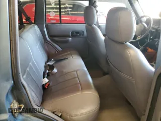 1998 Jeep Cherokee Country with VIN 1J4FT78S8WL252502, listed as a Copart auction lot 59664545 with 133,148 mi miles and Salvage title. Bid and sale history available at DreamBid. Image 10.