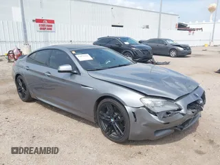 2014 BMW 6 Series 650i z VIN WBA6B2C55ED128934, wystawiony jako IAAI lot #42070641 z przebiegiem 102 597 mil mil oraz . Historia ofert i sprzedaży dostępna na DreamBid. Obrazek 1.
