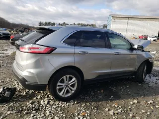 2020 Ford Edge SEL z VIN 2FMPK4J95LBA29912, wystawiony jako Copart lot #82968534 z przebiegiem 104 083 mil mil oraz Szkoda całkowita • Salvage title. Historia ofert i sprzedaży dostępna na DreamBid. Obrazek 3.