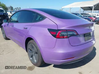 2020 Tesla Model 3 Standard Range Plus with VIN 5YJ3E1EA0LF739462, listed as a IAAI auction lot 42081889 with 65,254 mi miles. Bid and sale history available at carsss.com. Image 3.