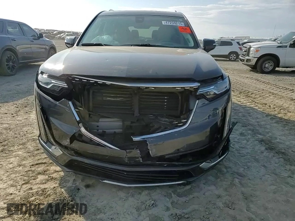 2021 Cadillac XT6 Premium Luxury z VIN 1GYKPCRS6MZ205831, wystawiony jako Copart lot #47259215 z przebiegiem 31 959 mil mil oraz Szkody całkowita. Historia ofert i sprzedaży dostępna na DreamBid. Obrazek 12.