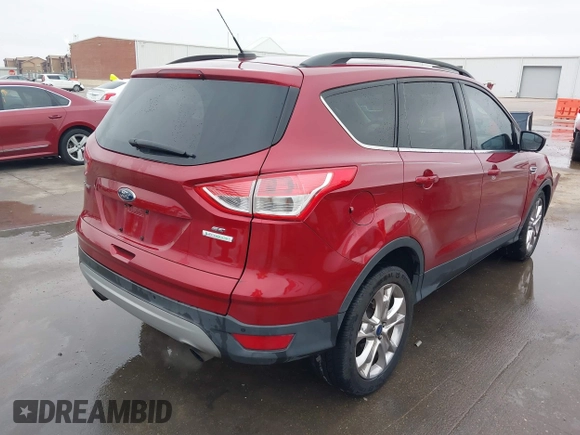 2015 Ford Escape SE with VIN 1FMCU0GXXFUC74470, listed as a IAAI auction lot 41419669 with 94,107 mi miles. Bid and sale history available at carsss.com. Image 4.