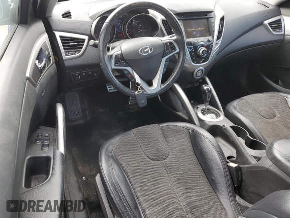 2012 Hyundai Veloster w/Red Int z VIN KMHTC6AD2CU048049, wystawiony jako Copart lot #85809854 z przebiegiem 122 914 mil mil oraz Szkoda całkowita • Salvage title. Historia ofert i sprzedaży dostępna na DreamBid. Obrazek 8.