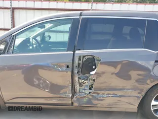 2014 Honda Odyssey Touring with VIN 5FNRL5H99EB075979, listed as a IAAI auction lot 42520154 with 99,314 mi miles and . Bid and sale history available at DreamBid. Image 15.