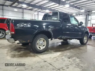 2000 Ford F-150 XL with VIN 1FTRX18L7YNA85909, listed as a Copart auction lot 56056165 with 134,765 mi miles and Salvage title. Bid and sale history available at DreamBid. Image 3.