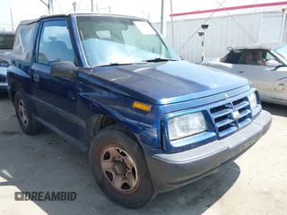 1997 Chevrolet Tracker z VIN 2CNBE1865V6926154, wystawiony jako IAAI lot #42207157 z przebiegiem 176 104 mil mil oraz . Historia ofert i sprzedaży dostępna na DreamBid. Obrazek 1.