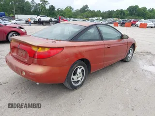 2002 Saturn SC z VIN 1G8ZR12742Z146956, wystawiony jako IAAI lot #42175290 z przebiegiem Nie podano mil oraz . Historia ofert i sprzedaży dostępna na DreamBid. Obrazek 4.