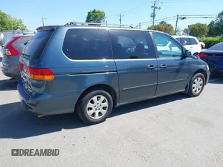 2004 Honda Odyssey EX with VIN 5FNRL18684B027564, listed as a IAAI auction lot 42044126 with 185,627 mi miles and . Bid and sale history available at DreamBid. Image 4.