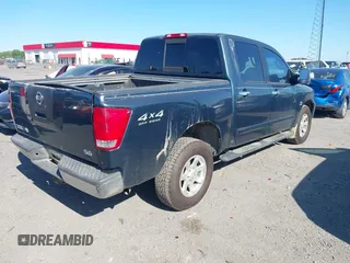 2004 Nissan Titan LE with VIN 1N6AA07B74N547779, listed as a IAAI auction lot 41977881 with 157,348 mi miles and . Bid and sale history available at carsss.com. Image 4.