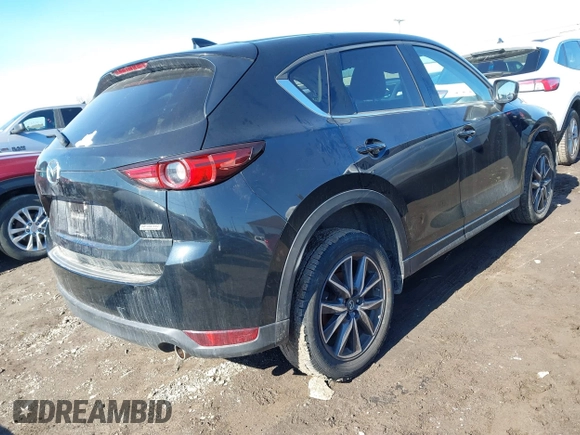 2018 Mazda CX-5 Grand Touring with VIN JM3KFBDM5J0441518, listed as a IAAI auction lot 41748941 with 64,639 mi miles. Bid and sale history available at carsss.com. Image 4.