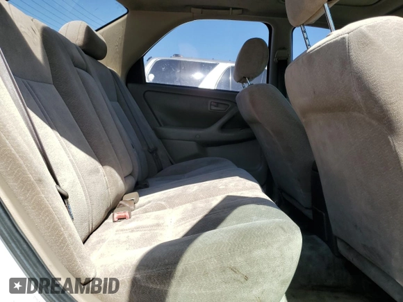 1997 Toyota Camry LE z VIN JT2BG22K9V0002215, wystawiony jako Copart lot #56932955 z przebiegiem 265 776 mil mil oraz Szkoda całkowita • Salvage title. Historia ofert i sprzedaży dostępna na DreamBid. Obrazek 10.