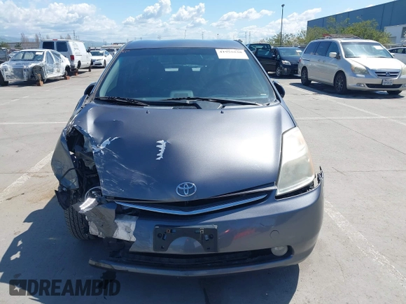 2007 Toyota Prius z VIN JTDKB20U273215633, wystawiony jako IAAI lot #41955538 z przebiegiem 172 957 mil mil oraz . Historia ofert i sprzedaży dostępna na DreamBid. Obrazek 12.