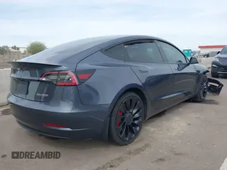 2022 Tesla Model 3 Performance with VIN 5YJ3E1EC3NF296891, listed as a IAAI auction lot 41808329 with 82,682 mi miles and . Bid and sale history available at DreamBid. Image 4.