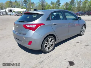 2013 Hyundai Elantra GT with VIN KMHD35LE9DU058163, listed as a IAAI auction lot 42067923 with 180,638 mi miles. Bid and sale history available at carsss.com. Image 4.